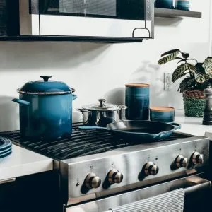 Kitchen stove with pots and pans; credit: dane deaner, unsplash