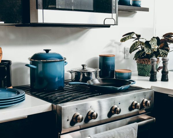 Kitchen stove with pots and pans; credit: dane deaner, unsplash